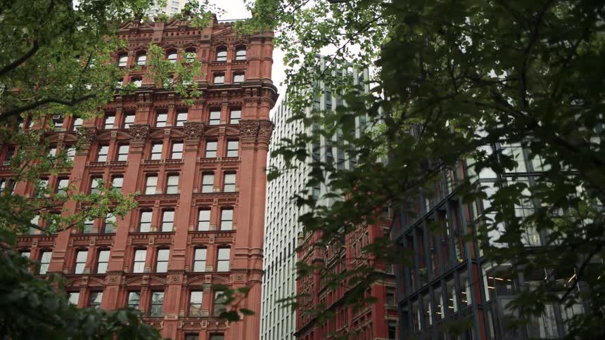 Tall stone buildings are in the city