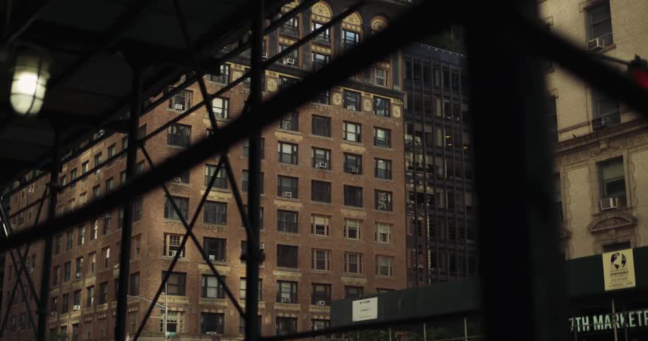 The scaffolding is on the sidewalks of the building
