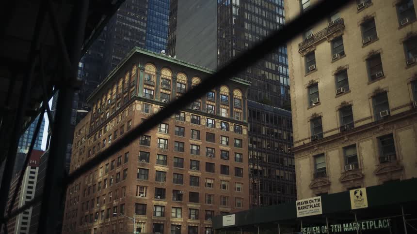 Scaffolding is on the side of the buildings