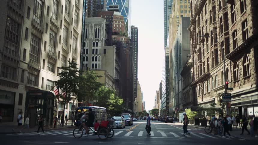 Pedestrians crossing the street with vehicle traffic