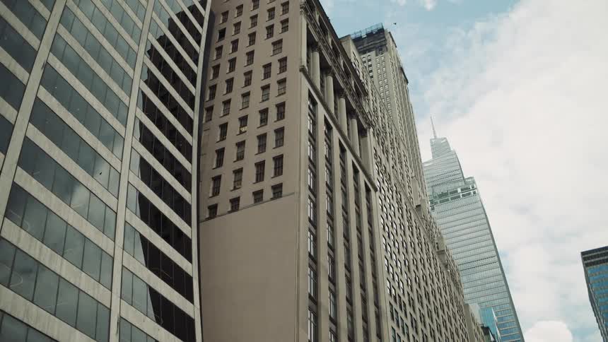 Tall high rise buildings stand tall in a downtown city