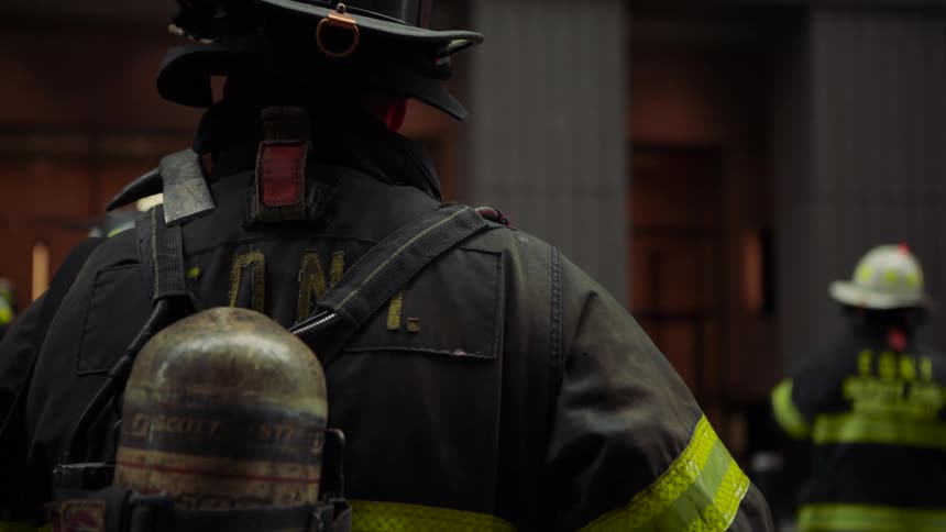 Group of firefighters outside a building