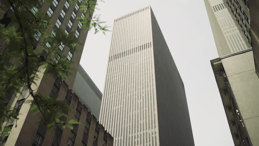 Buildings and skyscrapers against a cloudy sky