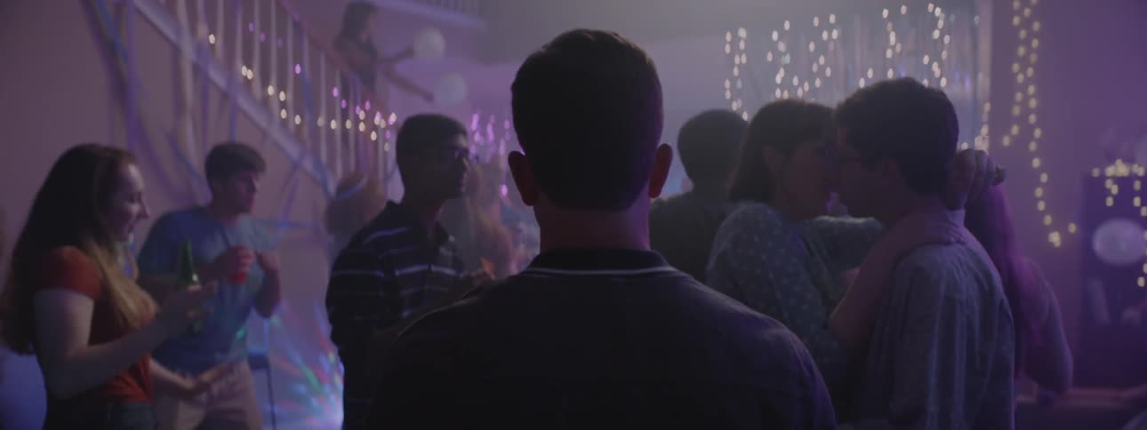 A shot is being filmed of a party