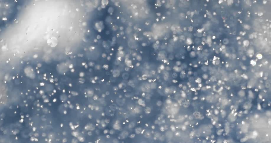 Millions of tiny white particles floating in the air
