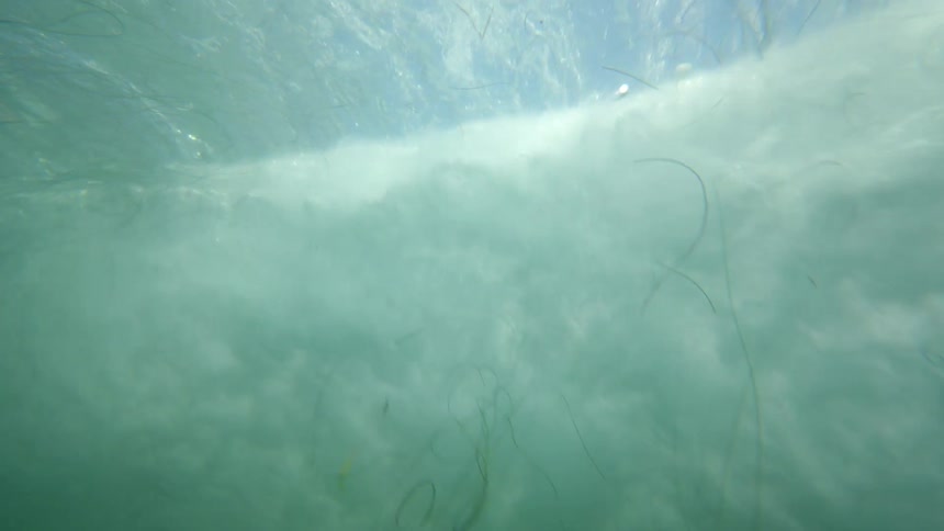 View from inside the sea of a crystalline wave breaking with force
