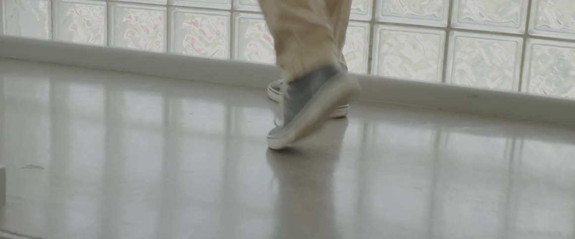 A person is walking up the stairs