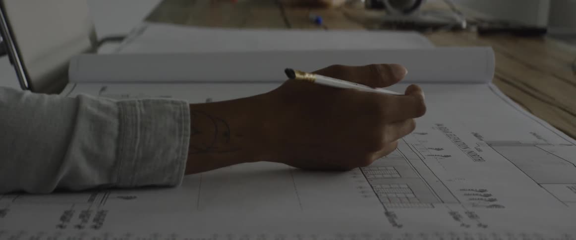 Pages of a blueprint are turned