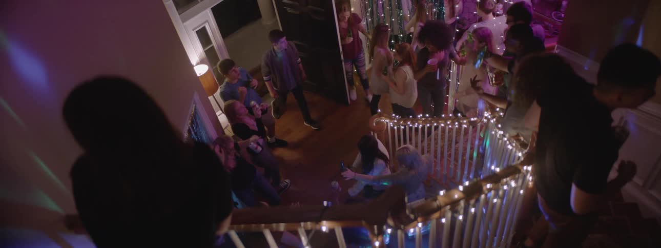 A group of people in a house having a party