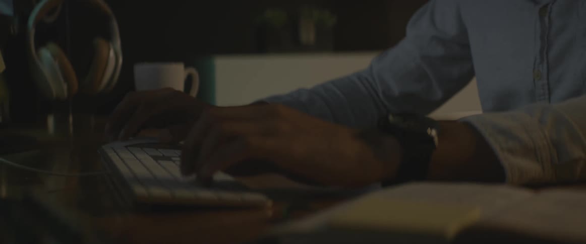 A person is typing on a keyboard