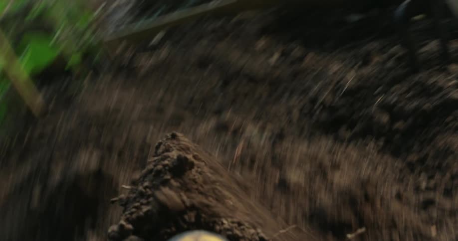 Shovel removing earth digging a hole