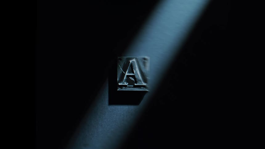 Beam of light illuminating a letter