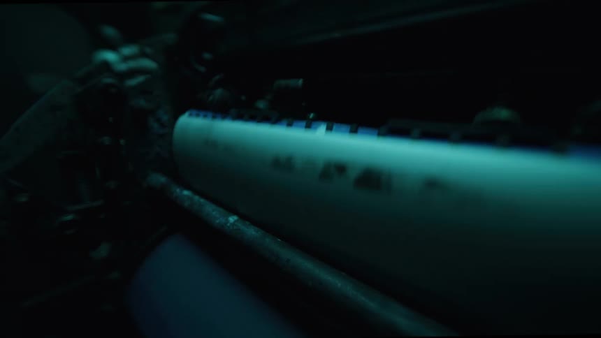 Hand handling a paper printing machine