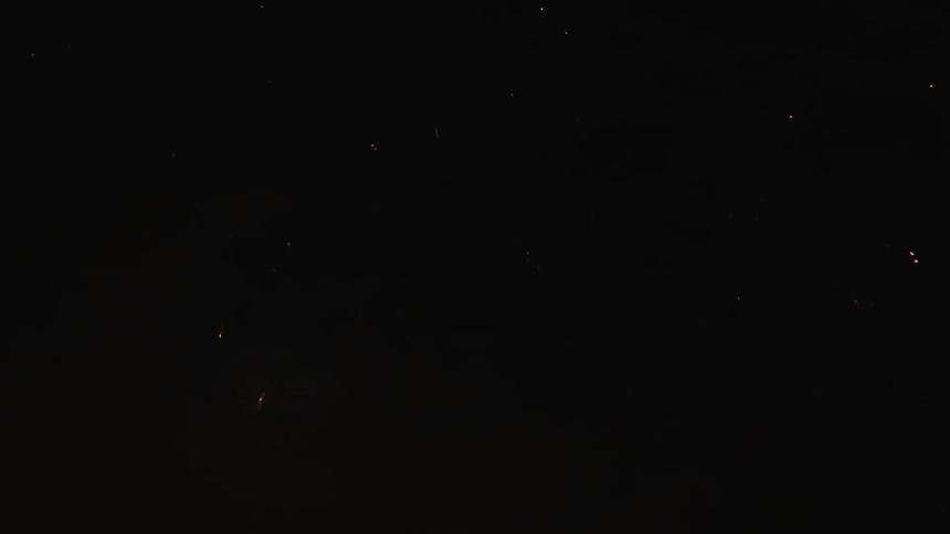 Fireworks explode in the night sky