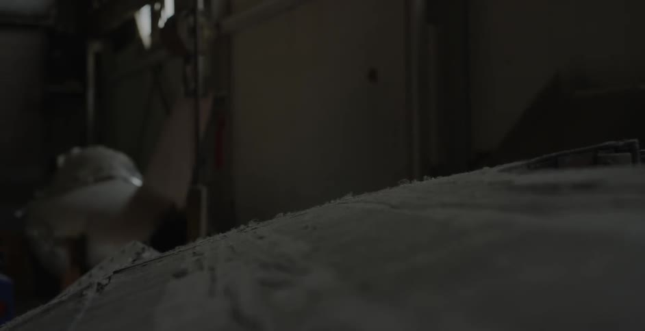 Dust settles on an object in a storage shed