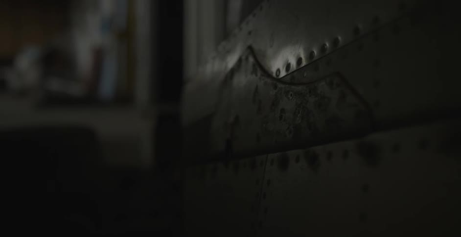 A wooden box in a dim room