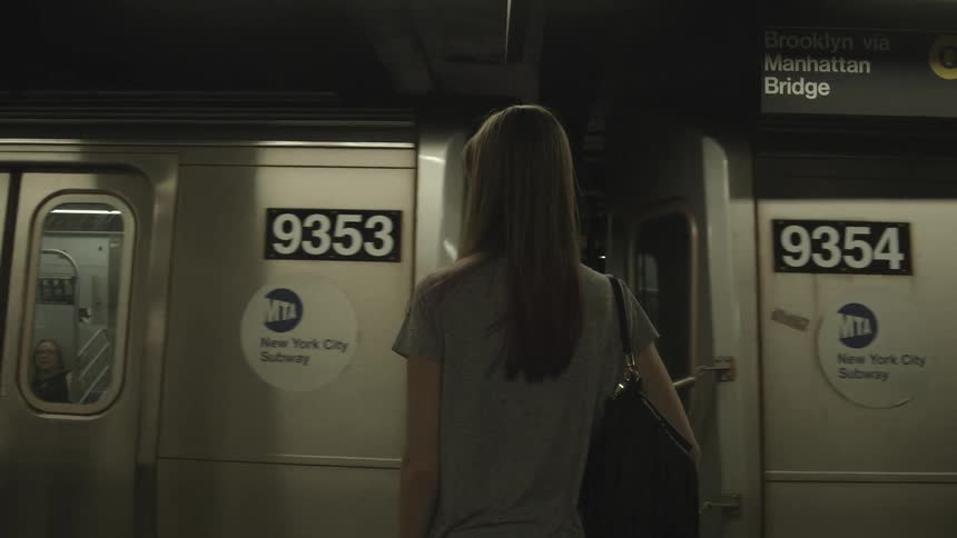 People waiting to board a subway