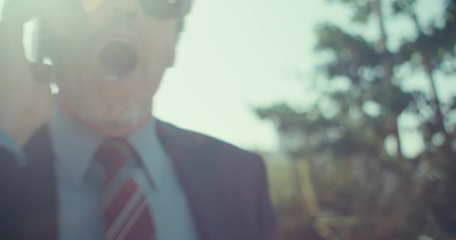 The man answers his cell phone and cheers at what he hears