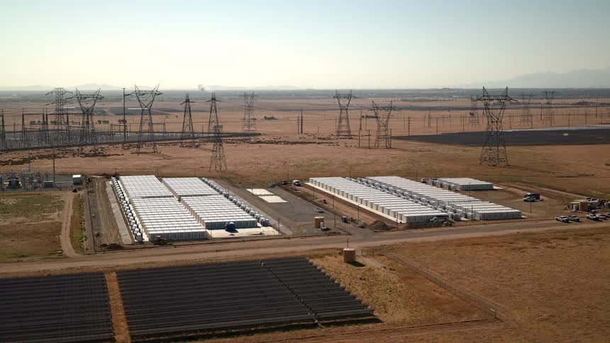 Aerial shot of energy facility with solar panels in desert