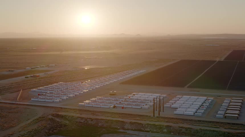 Aerial view of a solar power station with solar panels on a vast field