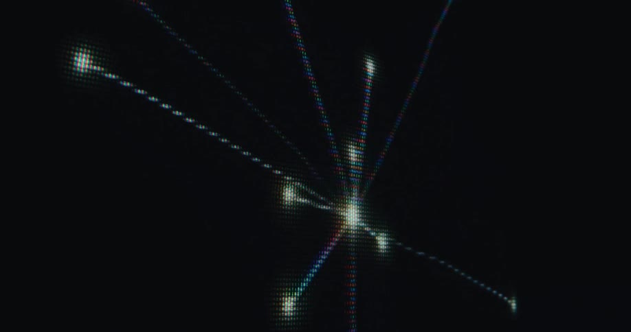 On a pixelated screen an abstract network of glowing points and lines expands outward from a central hub against a black background