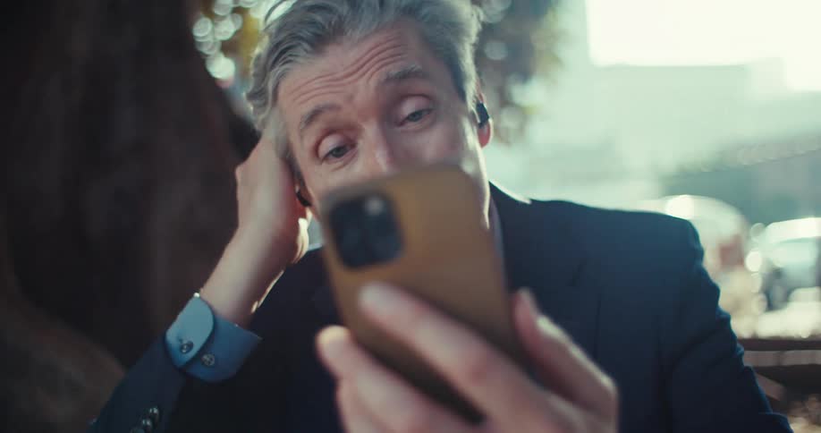 Man in suit on video call smiling and enjoying a fun conversation