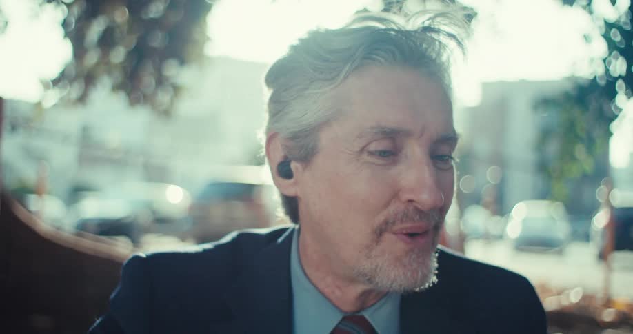 Man on a video call while sitting outdoors