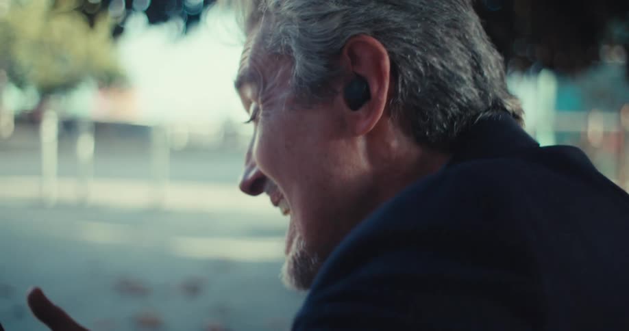 Man in suit sitting with happy expression