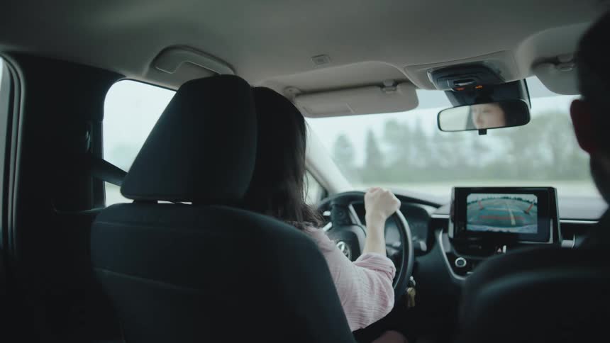 The teenager is learning to drive