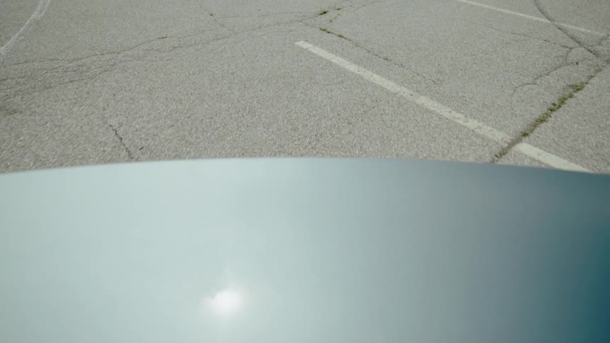 Car reversing and hitting cones