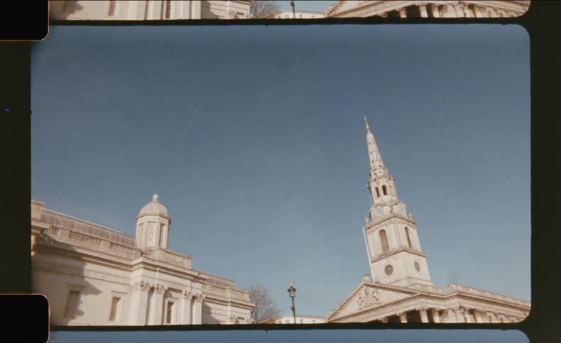 Cathedral stands near a building with similar architecture under a blue winter sky