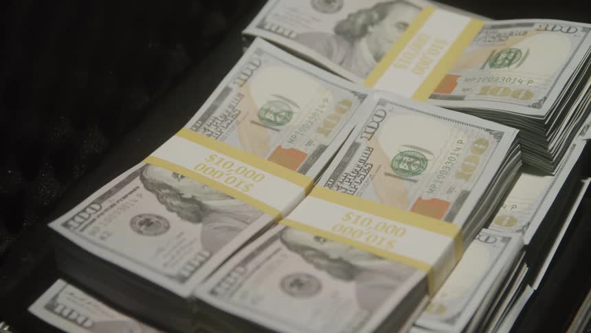 Stack of money with 100 dollar bills