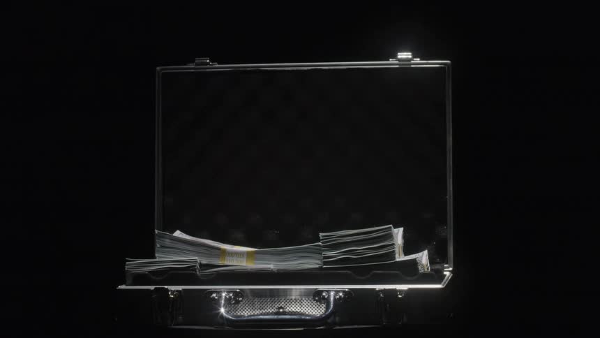 The briefcase full of money is turning on the platform