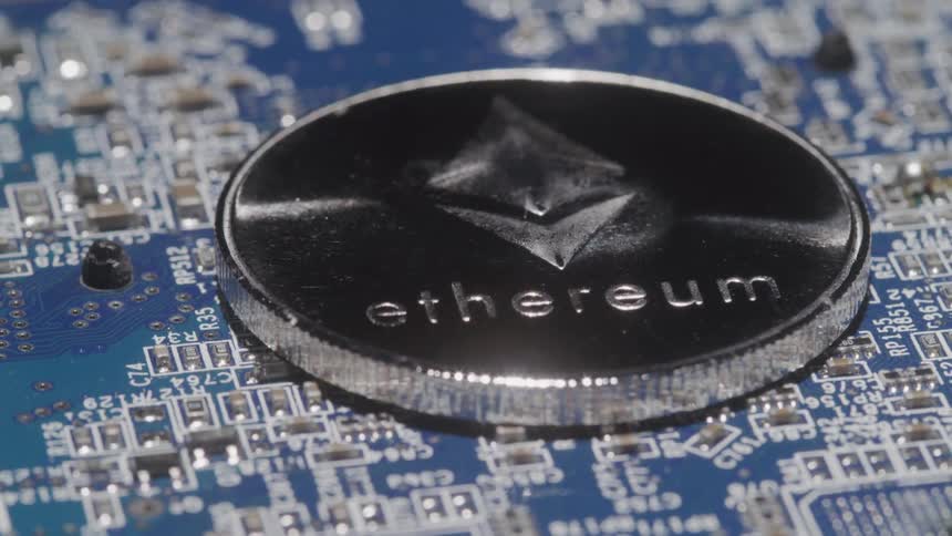 Metal coin on top of a circuit