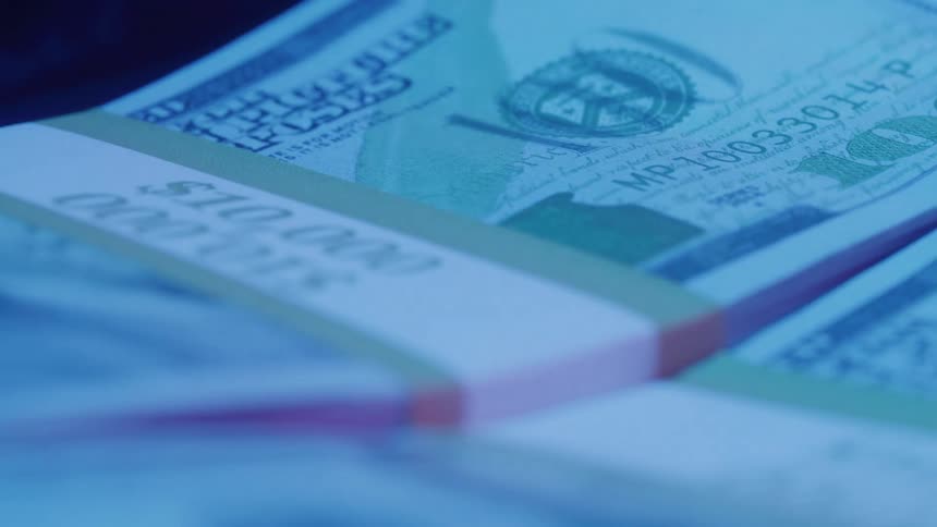 Stacks of cash are spinning together