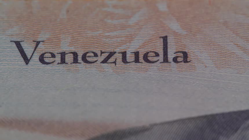 A venezuelan 2 bolvares banknote features detailed security elements and national symbols