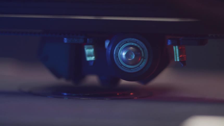 Closeup of a 3d printer nozzle actively printing an object