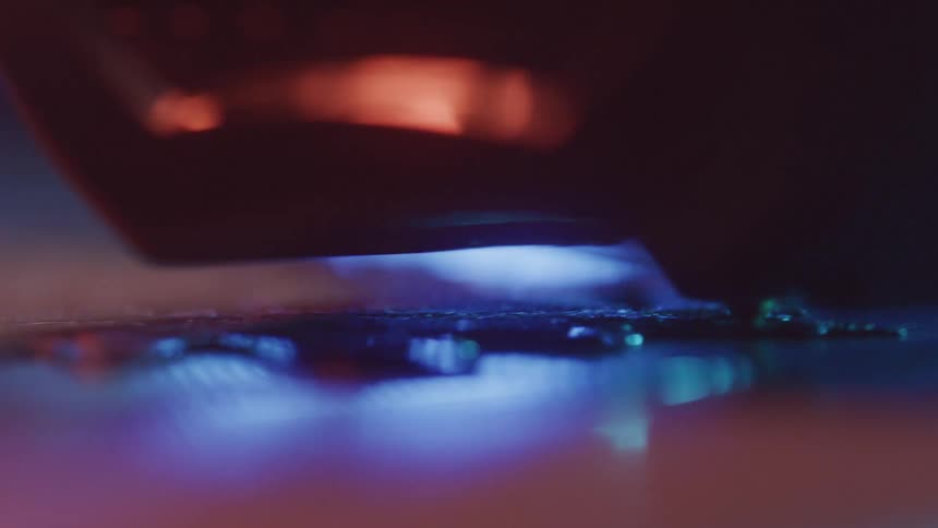 A bluelit 3d printer nozzle moves with precision extruding material onto a surface to build an object layer by layer the closeup shot emphasizes the intricate and futuristic nature of the additive manufacturing process