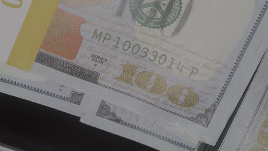 Close up of ten thousand dollars stacks of one hundred dollar bills