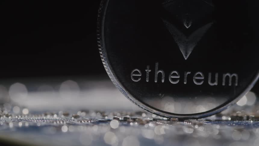 A crypto coin is on the computer board