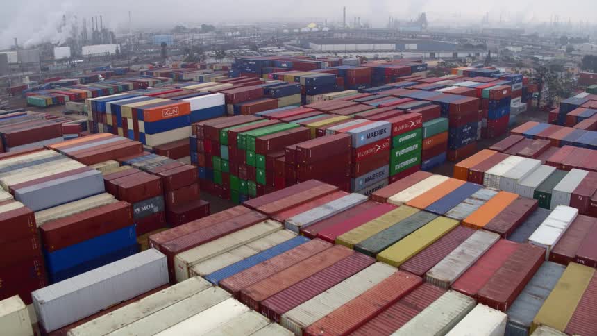 Aerial of cargo containers in a shipping yard on a cloudy day