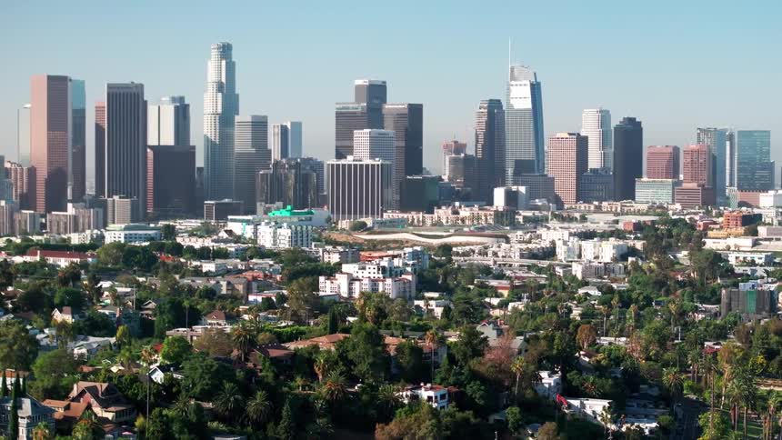 Aerial of a housing neighborhood near a metropolis on a sunny day