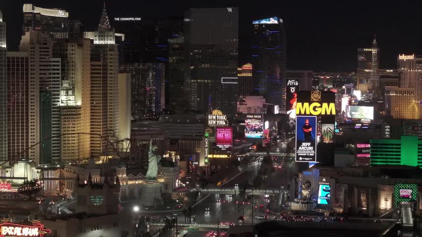 The big city has lit billboards by some buildings