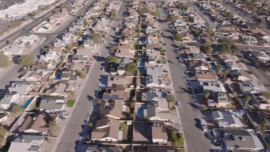 Rows of suburban houses line a grid of neighborhood streets