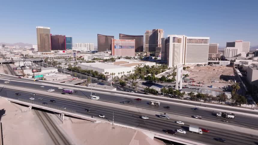 Aerial of a busy freeway and underpass in a metropolitan city during daytime