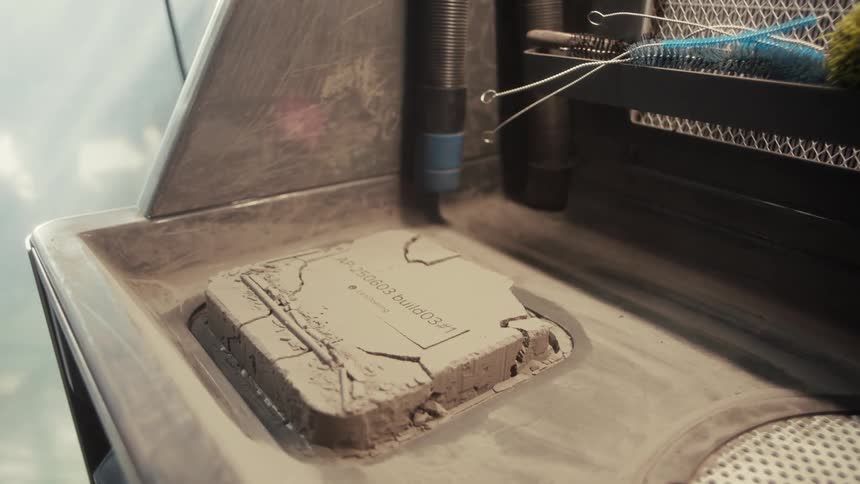 A 3d printer creates a layered object with precision in an industrial setting