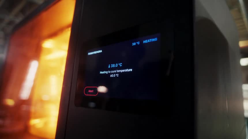 The display on the machine shows rising temperatures