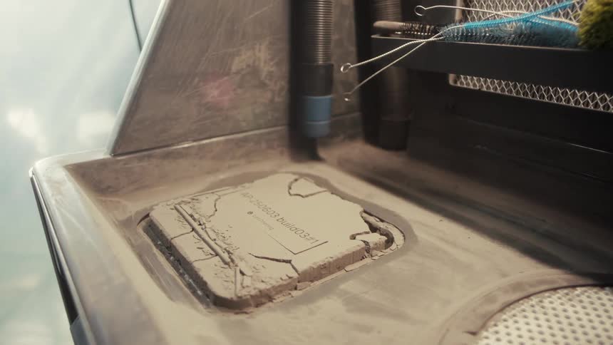 A 3d printer is printing an object with material forming on the build platform