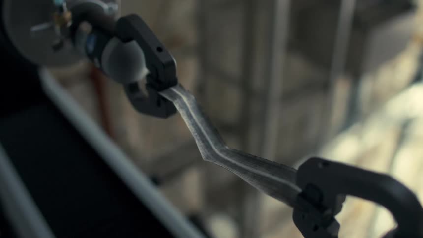The machine stretches the fabric