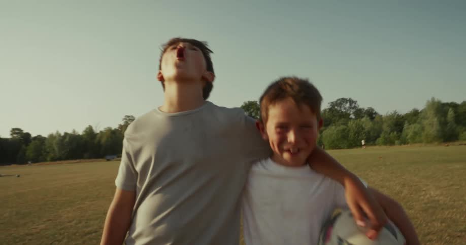 Two kids are celebrating their soccer win together